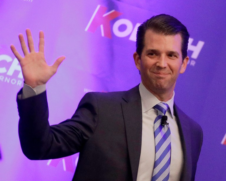 Donald Trump Jr. waves to the audience during a fundraiser.