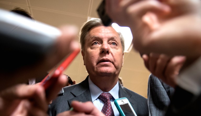With reporters looking for updates, Sen. Lindsey Graham, R-S.C., talks to people on Capitol Hill in Washington, D.C.