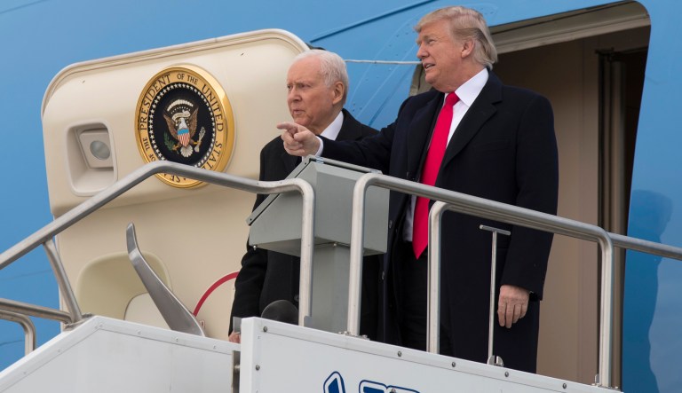President Donald Trump stands with Sen. Orrin Hatch, R-Utah, after arriving at Salt Lake City International Airport, Monday, Dec. 4, 2017, in Salt Lake City.