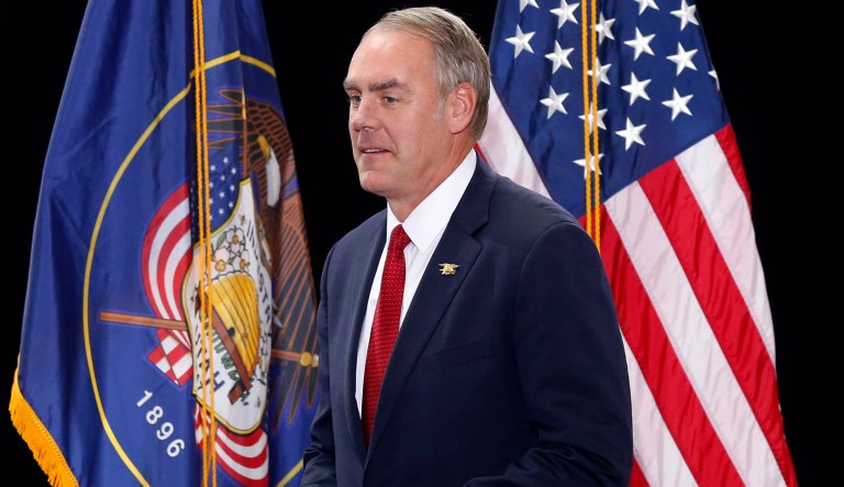 Interior Secretary Ryan Zinke takes the stage at the Utah State Capitol in Salt Lake City.