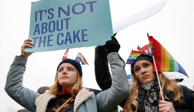 Lydia Macy, 17, left, and Mira Gottlieb, 16, both of Berkeley, Calif., rally outside of the Supreme Court as it hears the 'Masterpiece Cakeshop v. Colorado Civil Rights Commission' case on Dec. 5, 2017, in D.C. 