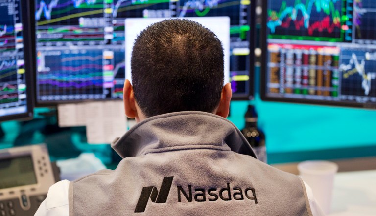 FILE - In this April 16, 2015, file photo, an employee monitors prices at the tech-driven Nasdaq MarketSite in New York. From Silicon Valley to Shanghai, surging share prices for technology companies means the industry is making up an ever-larger chunk of stock funds. Tech companies have been able to produce strong profit growth for years, even when the global economy was scuffling, but the strong performance also raises worries that theyâre overpriced.