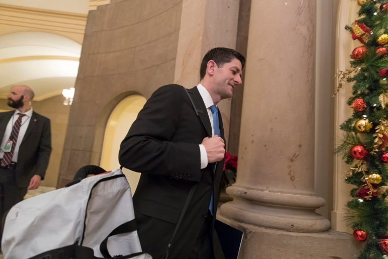 Speaker of the House Paul Ryan, R-Wis., arrives at his office carrying a gym bag as the Republican majority in Congress prepares to deliver the biggest reshaping of the U.S. tax code in three decades, on Capitol Hill, in Washington, Tuesday morning, Dec. 19, 2017.