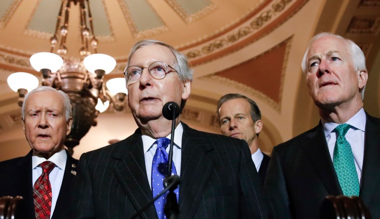 Senate Majority Leader Mitch McConnell of Ky., second from right, speaks after their caucus luncheon, with Sen. Cory Gardner, R-Colo., left, Sen. John Barrasso, R-Wyo., Sen. Orrin Hatch, R-Utah, Sen. John Thune, R-S.D., and Sen. John Cornyn, R-Texas, right, on Capitol Hill, Tuesday, Dec. 19, 2017 in Washington.