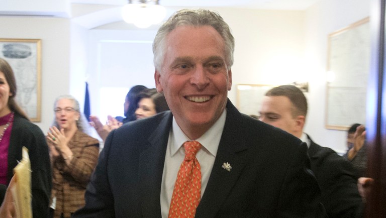 Virginia Gov. Terry McAuliffe, walks out of the House Democratic Caucus prior to opening ceremonies of the 2018 session of the Virginia House of Delegates.