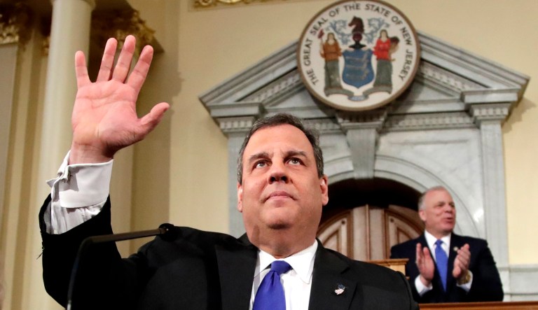 Then-Gov. Chris Christie, R-N.J., (left) gestures to lawmakers before delivering his final state of the state address at the Statehouse in Trenton, N.J.
