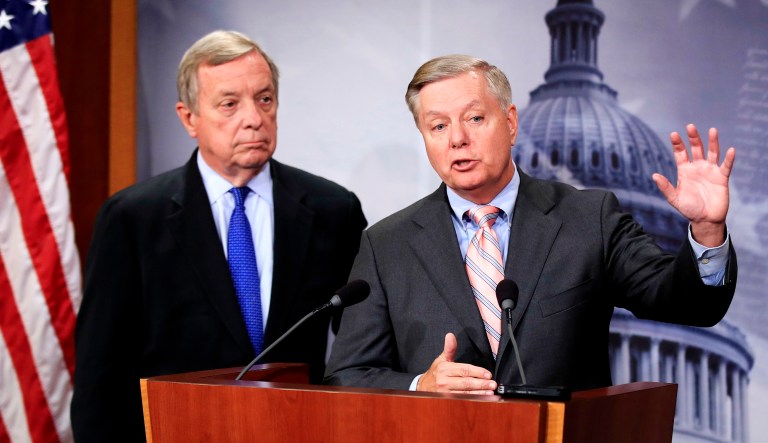 Sen. Lindsey Graham, R-S.C., right, with Sen. Dick Durbin, D-Ill., speak during a news conference on Capitol Hill in Washington.