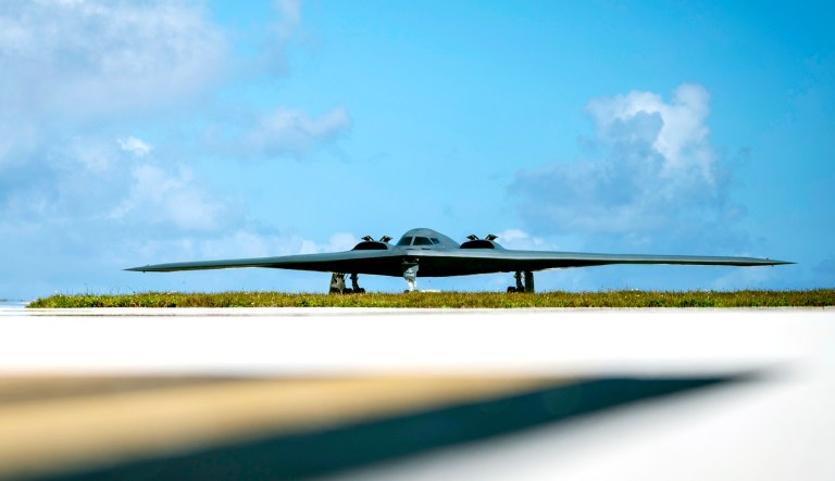 A B-2 Spirit plane, assigned to the 509th Bomb Wing, Whiteman Air Force Base, taxis on the flightline at an Air Force base.