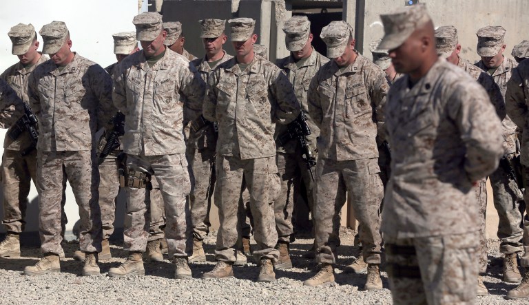 U.S. Marines stay silent during the change of command ceremony at Task Force Southwest military field in Shorab military camp of Helmand province, Afghanistan, Monday, Jan. 15, 2018.