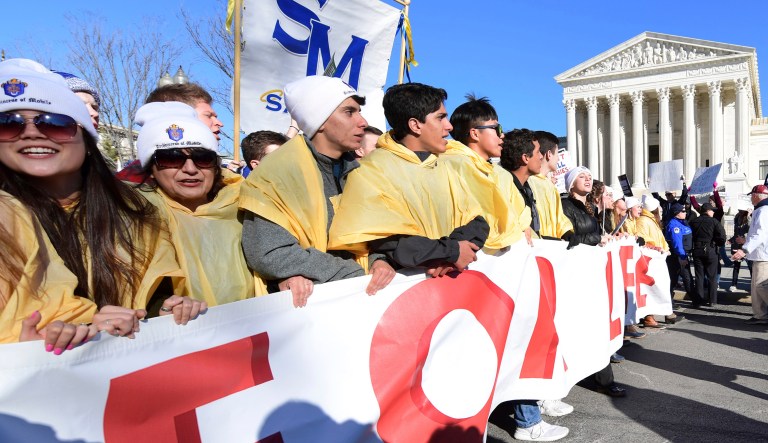People participate in the March for Life near the Supreme Court in Washington, Friday, Jan. 19, 2018. 