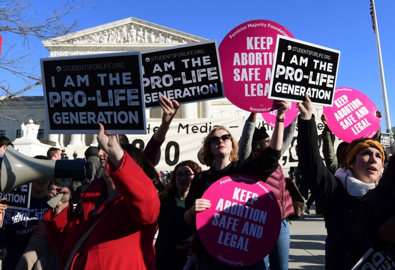 Protesters on both sides of the abortion issue gather outside the Supreme Court in Washington.