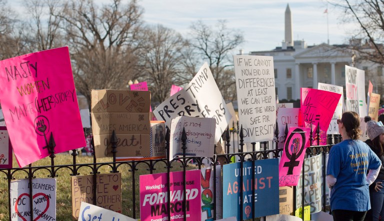 Signs are left at the base of statue of President Andrew Jackson in Lafayette Park, across the street from the White House in Washington, D.C., following the end of the Women's March.