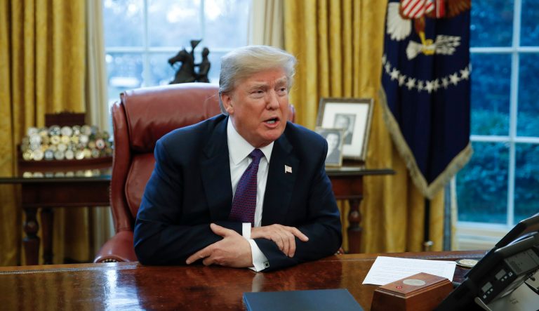 President Donald Trump speaks to media after signing Section 201 actions in the Oval Office of the White House in Washington, Tuesday, Jan. 23, 2018.