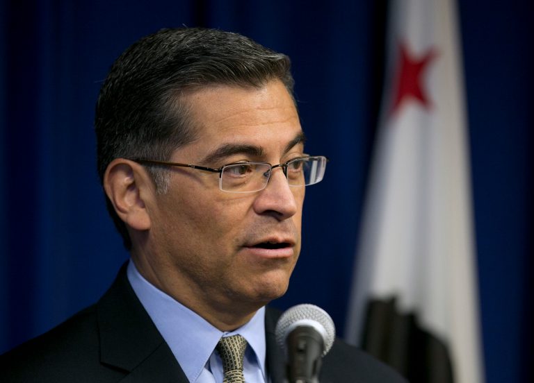 California Attorney General Xavier Becerra discusses about a lawsuit during a press conference.