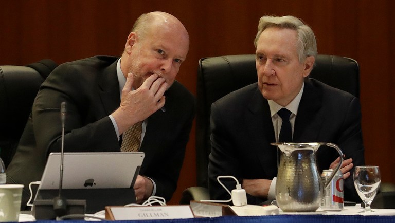 UC Irvine Chancellor Howard Gillman, left, talks with Regent George Kieffer during a meeting in San Francisco.