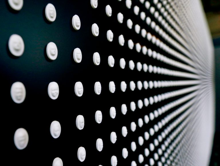 A portion of the 22,000 pills with faces carved into them are on display in a memorial by the National Safety Council to the victims of the opioid epidemic at the University of Pittsburgh, Monday, Jan. 29, 2018, in Pittsburgh.