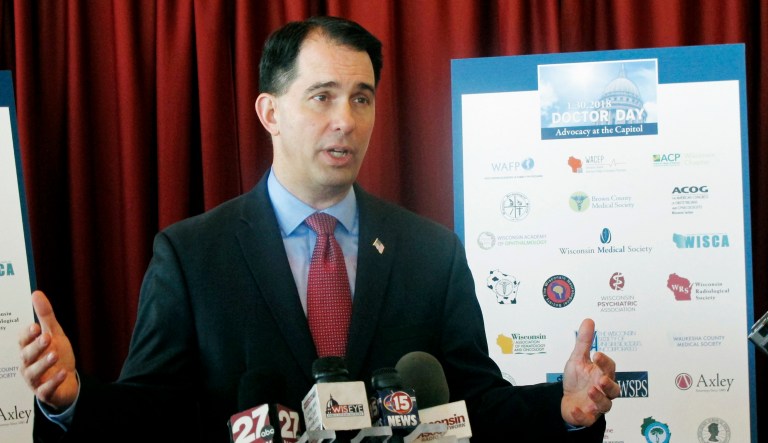 Wisconsin Gov. Scott Walker touts proposals he says will stabilize the state's insurance market. 