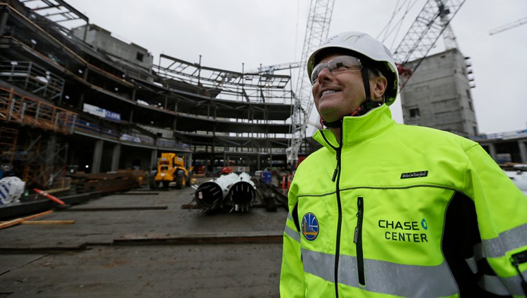 Golden State Warriors President and COO Rick Welts looks up at Chase Center under construction in San Francisco.