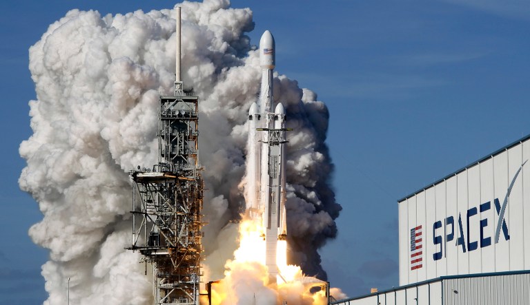 A SpaceX heavy rocket lifts off from pad 39A at the Kennedy Space Center in Cape Canaveral, Fla.