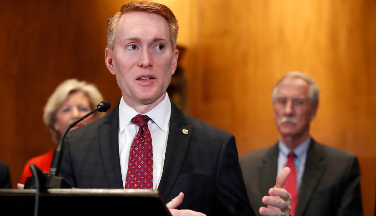 Sen. James Lankford, R-Okla., left, with Sen. Angus King, I-Maine, right, speaks about immigration and the Deferred Action for Childhood Arrivals (DACA) program Wednesday, Feb. 7, 2018, on Capitol Hill in Washington. 