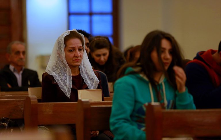 Iraqi Christians pray during Sunday Mass in the Virgin Mary church in Baghdad, Iraq, on Feb. 11.