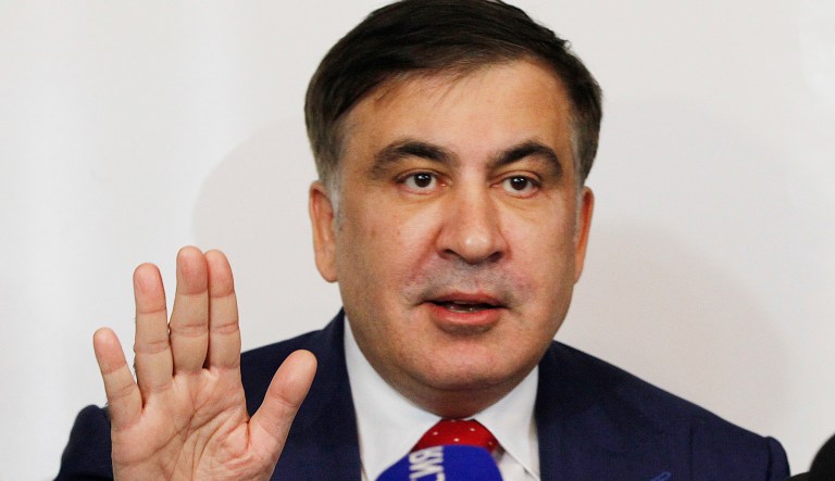 Mikheil Saakashvili, former Georgian president-turned-Ukrainian opposition leader, speaks to reporters in Warsaw, Poland, Tuesday, Feb. 13, 2018. Saakashvili was deported from Ukraine to Poland on Monday after being detained by armed, masked men at a restaurant in Kiev and rushed to the airport.
