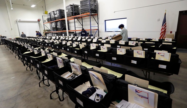 Workers prepare election day kits in Texas.