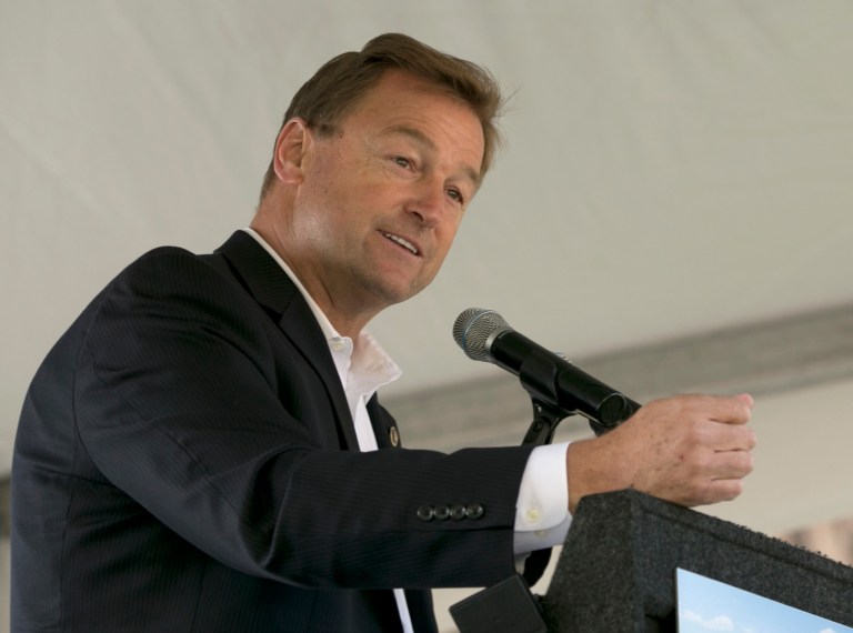 FILE - In this Aug. 22, 2017, file photo Sen. Dean Heller, R-Nev. speaks at the 21st Annual Lake Tahoe Summit in South Lake Tahoe, Calif. When Ivanka Trump assembled a group of Republican senators at her Washington home in the fall of 2017, the guest list included one particularly notable name, Heller. But within weeks of dining with the presidentâs daughter and adviser, Heller, who is up for re-election in 2018, was working closely with the White House, writing part of the Republican tax bill doubling the tax credit for families with children.