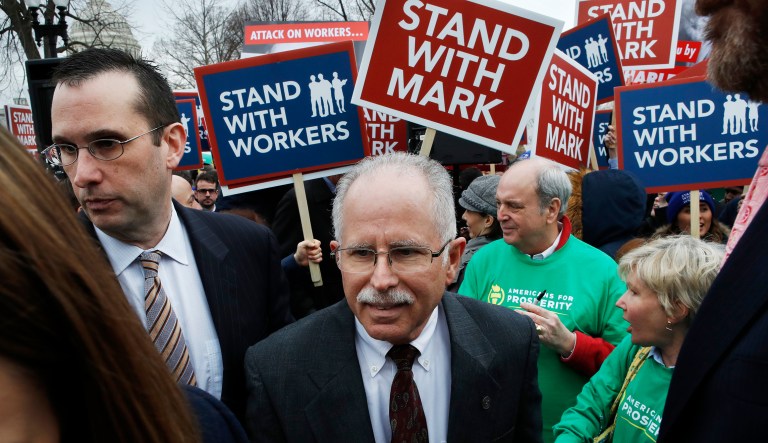 Illinois government employee Mark Janus, center, turns after thanking supporters outside the Supreme Court. 