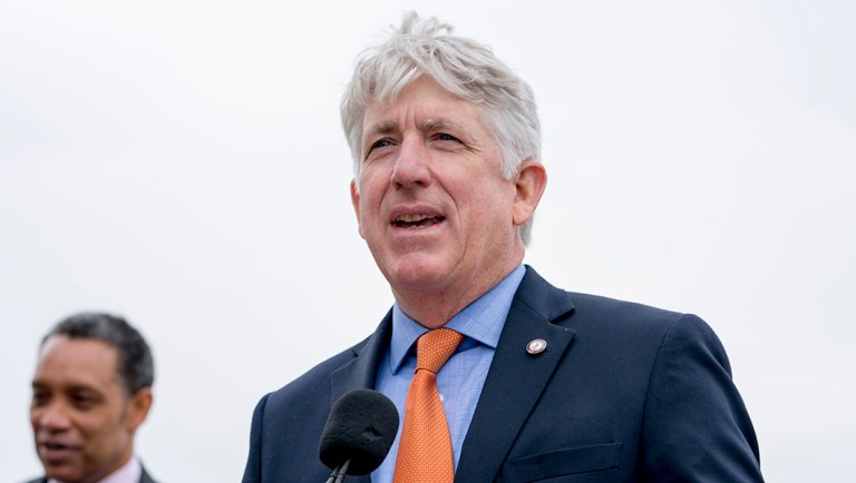 Virginia Attorney General Mark Herring speaks at a news conference near the White House.