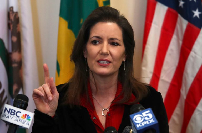 Oakland Mayor Libby Schaaf gestures while speaking during a media conference in California.