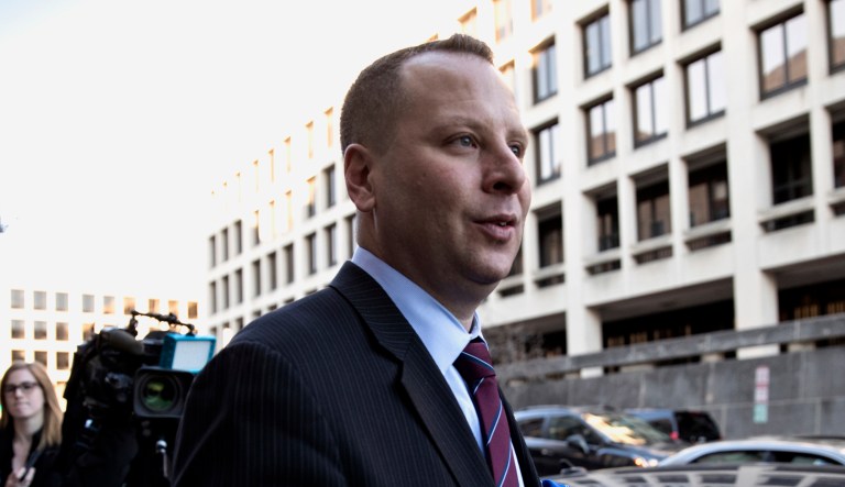 Former Donald Trump campaign aide Sam Nunberg, left, leaves the U.S. District Courthouse after a day before a grand jury as ordered by special counsel Robert Mueller who is investigating the campaign's ties to Russian officials, in Washington, Friday, March 9, 2018.