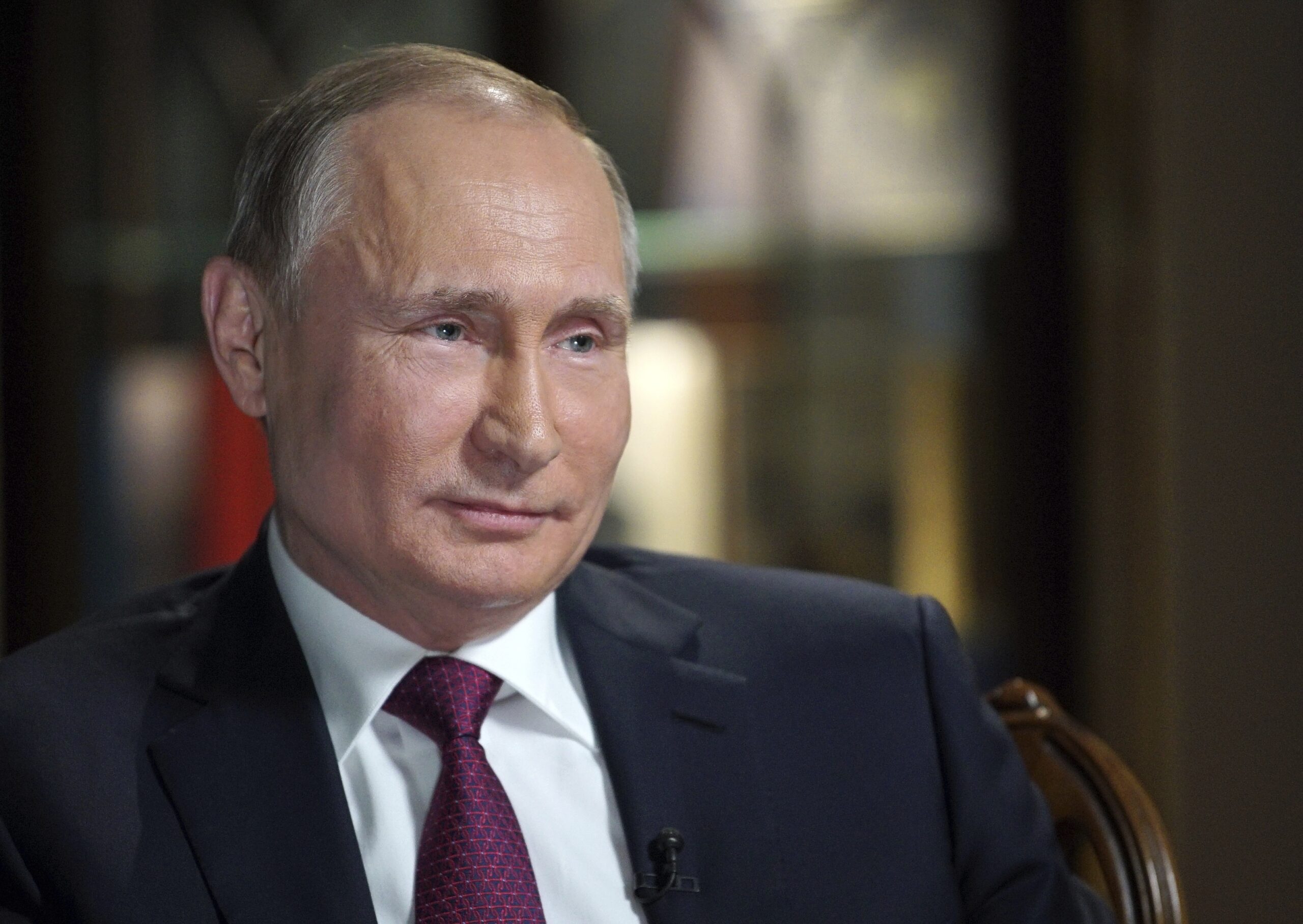 Exit polls suggest Putin easily wins re-election