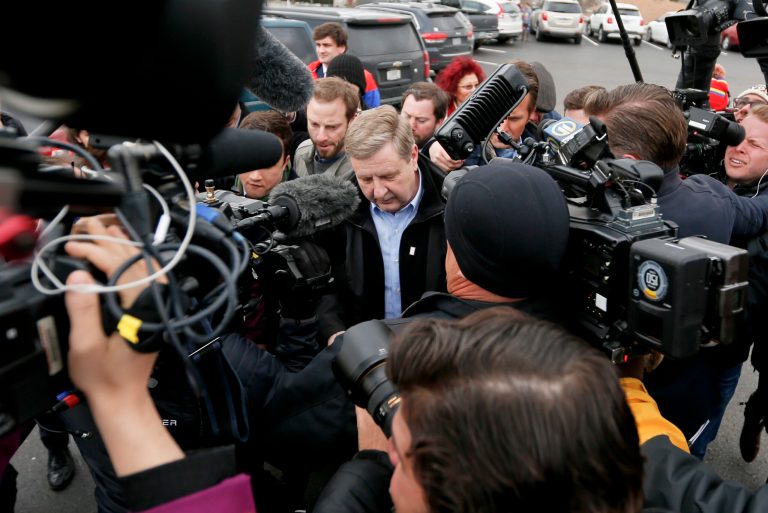 Republican Rick Saccone, center, makes his way through a gang of cameras and reporters on Tuesday as he heads to the polling place to cast his ballot in McKeesport, Pa. Saccone ran against Democrat Conor Lamb in a special election being held in Pennsylvania for the 18th Congressional District vacated by Republican Tim Murphy.