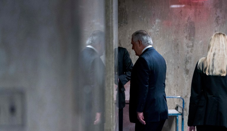 Secretary of State Rex Tillerson walks down a hallway after speaking at a news conference at the State Department in Washington, Tuesday, March 13, 2018.