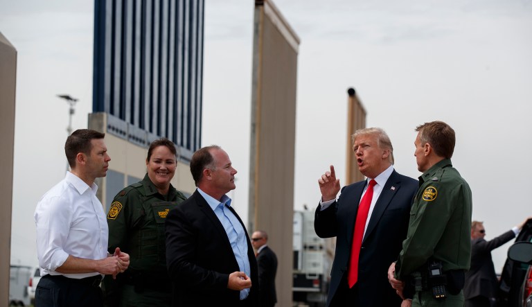 President Donald Trump reviews border wall prototypes, Tuesday, March 13, 2018, in San Diego.