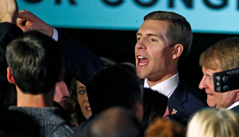 Conor Lamb, the Democratic candidate for the March 13 special election in Pennsylvania's 18th Congressional District, center, celebrates with his supporters at his election night party in Canonsburg, Pa.