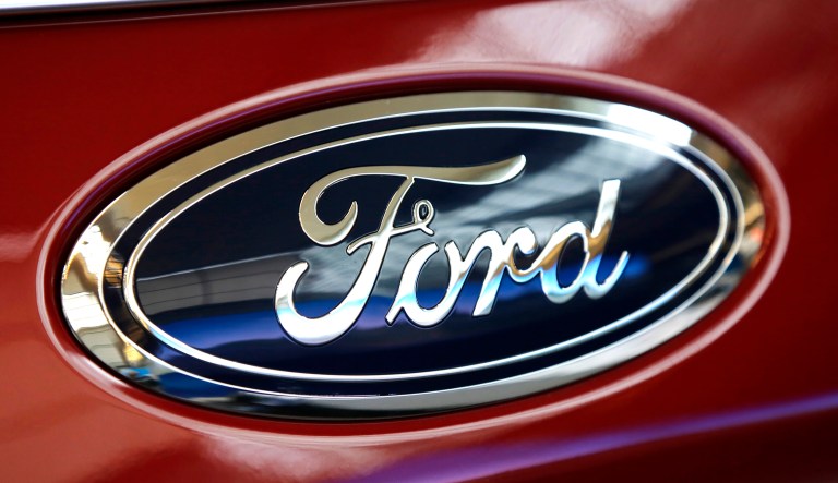 This shows a Ford logo on a vehicle at the Pittsburgh Auto Show in Pittsburgh.