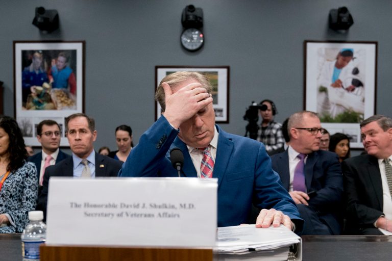 Veterans Affairs Secretary David Shulkin, center, arrives for a House Appropriations subcommittee hearing on Capitol Hill in Washington, Thursday, March 15, 2018.