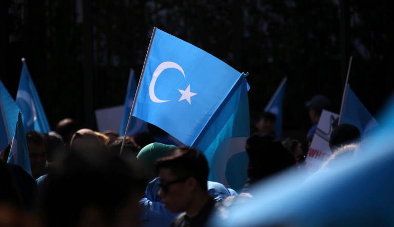 Uighurs and their supporters rally across the street from United Nations headquarters in New York, March 15, 2018.