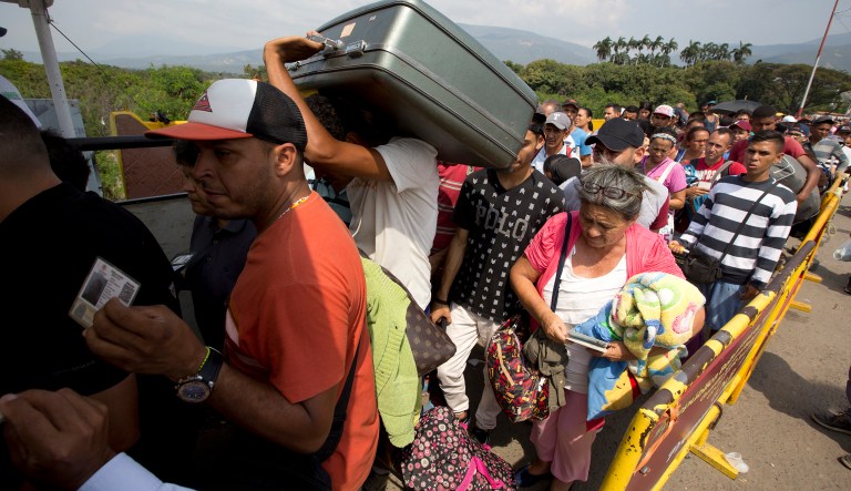 Venezuelans cross the International Simon Bolivar bridge into Cucuta, Colombia, as rising numbers of Venezuelans are fleeing in a burgeoning refugee crisis that could soon match the flight of Syrians from the war-torn Middle East. 