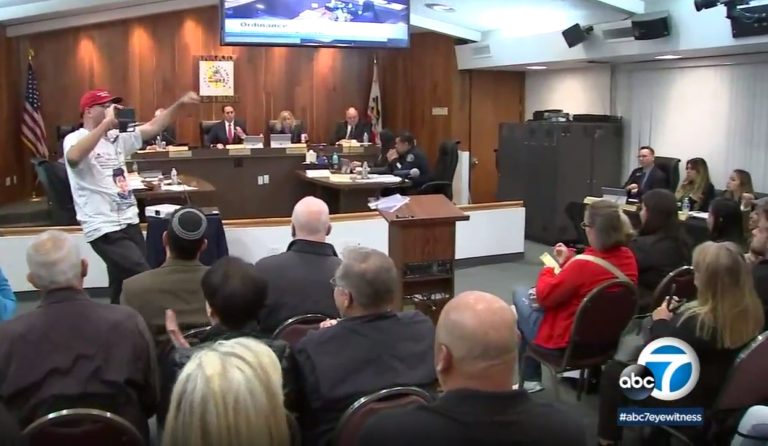 In this Monday, March 19, 2018 image made from video provided by KABC-7 councilmembers listen during a meeting in Los Alamitos, Calif. Leaders of the small California city in Orange County have given preliminary approval to a measure to exempt the city from a state law that limits cooperation between local police and federal immigration agents. Councilmembers voted 4-1 Monday night in favor of an ordinance to opt out of California's law, citing constitutional concerns. A required second vote is expected on April 16.