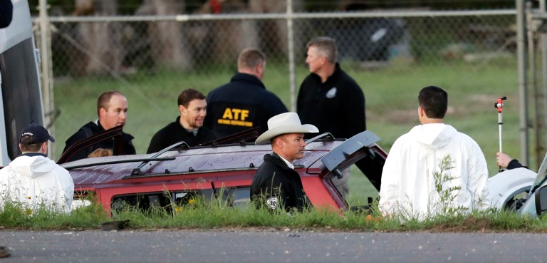 Officials investigate the scene where a suspect in a series of bombing attacks in Austin blew himself up as authorities closed in, Wednesday, March 21, 2018, in Round Rock, Texas. 