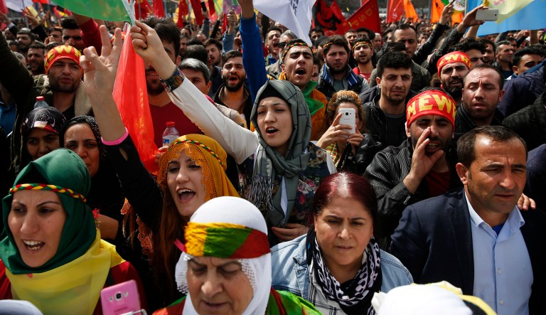 People chant slogans during the Newroz celebrations, marking the start of spring, in Istanbul.