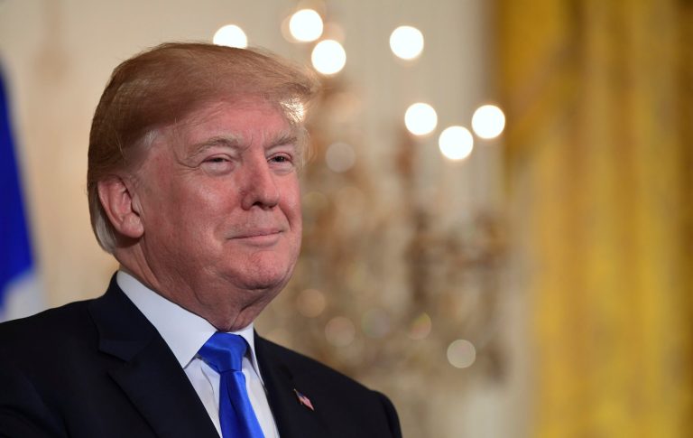 President Trump attends a reception in the East Room of the White House.