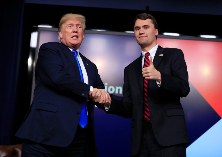President Donald Trump shakes hands with moderator Charlie Kirk, during a Generation Next White House forum at the Eisenhower Executive Office Building on the White House complex in Washington, Thursday, March 22, 2018.