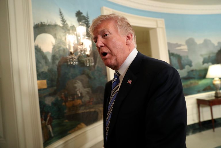 President Trump walks out of the Diplomatic Room of the White House in Washington on Friday after speaking about the $1.3 trillion spending bill.