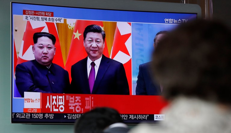 People watch a news program on TV reporting about the meeting between North Korean leader Kim Jong Un and Chinese President Xi Jinping at the Seoul Railway Station in Seoul, South Korea, Wednesday, March 28, 2018. North Korea's leader Kim and his Chinese counterpart Xi sought to portray strong ties between the neighbors and long-time allies despite a recent chill, as both countries on Wednesday confirmed Kim's secret trip to Beijing this week.