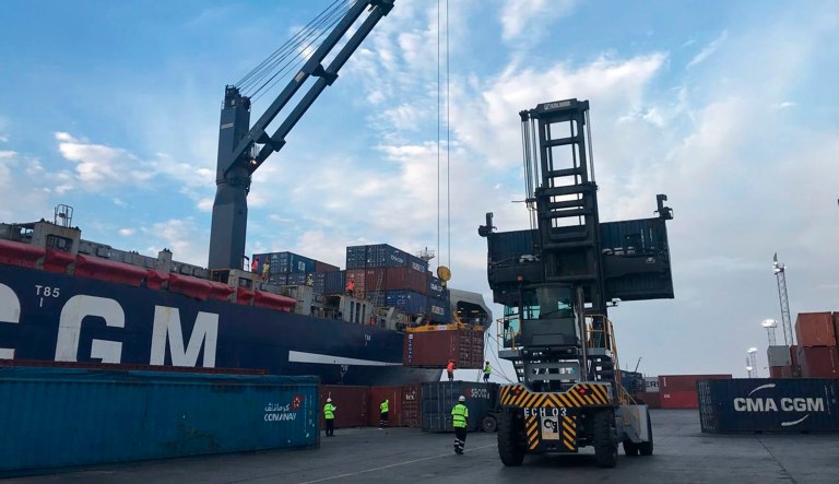 In this Sunday, April 1, 2018 photo, containers are loaded onto a cargo ship at the Port of Berbera, run by DP World, which is majority-owned by the Dubai government in the UAE, in Berbera, Somaliland, Somalia. The breakaway northern region of Somaliland declared its independence nearly three decades ago, but despite having its own currency, parliament and military the predominantly Muslim country hasnât been recognized by any foreign government. President Muse Bihi Abdi is hoping to change that by aligning his countryâs interests with energy-rich Gulf Arab states eager to expand their military footprint in the Horn of Africa.