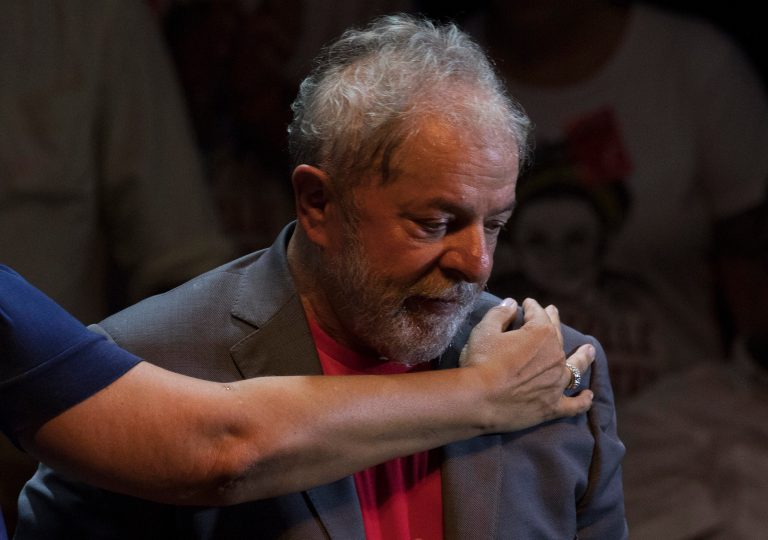 Brazil's former President Luiz Inacio Lula da Silva is embraced during his presidential campaign rally with members of his Workers Party and leaders of other left-wing parties in Rio de Janeiro, Brazil on Monday.